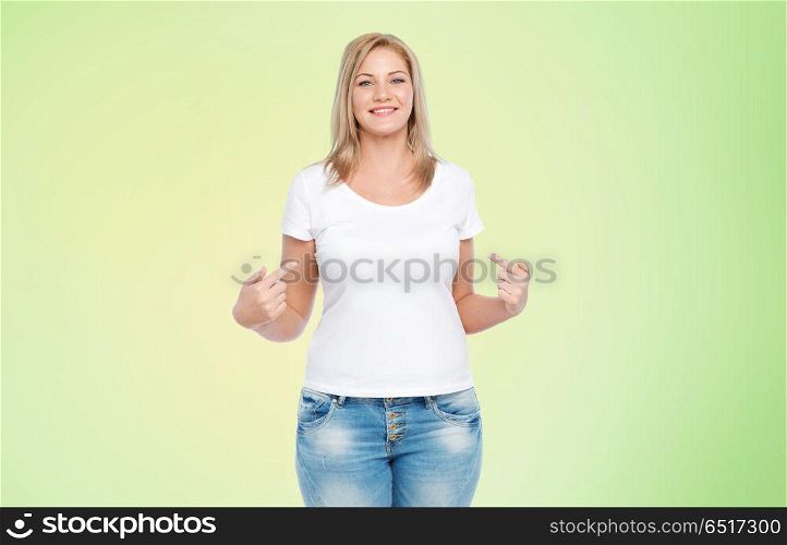 body positive, plus size and people concept - happy woman in white t-shirt pointing fingers to herself over lime green background. woman in white t-shirt pointing fingers to herself. woman in white t-shirt pointing fingers to herself