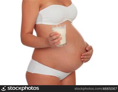 Body pregnant in underwear with milk glass isolated on a white background