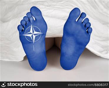 Body under a white sheet, suicide, sleeping, murder or natural death, NATO symbol