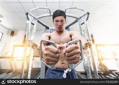 Bodybuilder Men workout with cable in gym focus muscle on chest feeling so strong and powerful,Bodybuilder Concept