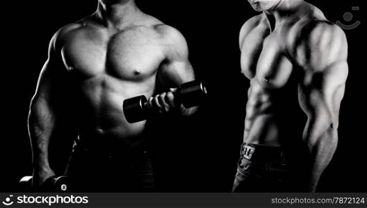 bodybuilder posing. Handsome power athletic guy male. Fitness muscular body on black background. Black and white photo