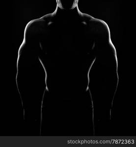 bodybuilder posing. Handsome power athletic guy male. Fitness muscular body on black background. Black and white photo