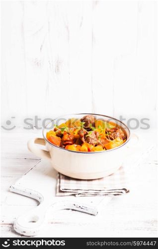 Boeuf Bourguignon - stewed meat with vegetables in casserole. Boeuf Bourguignon