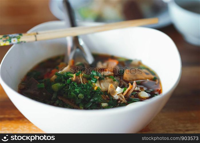 Boil pork blood, Thai food, placed on a wooden table, blurred scenes