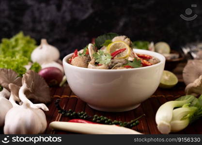 Boil the fish infusion with tomatoes, mushrooms, coriander, spring onion and lemongrass in a bowl.