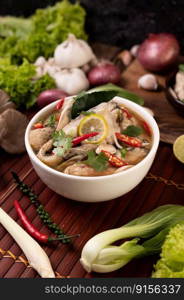 Boil the fish infusion with tomatoes, mushrooms, coriander, spring onion and lemongrass in a bowl.