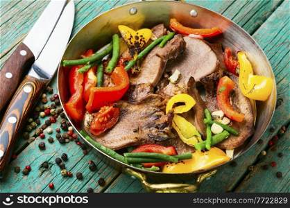 Boiled beef tongue with bell pepper.Sliced beef tongue. Beef tongue with vegetables