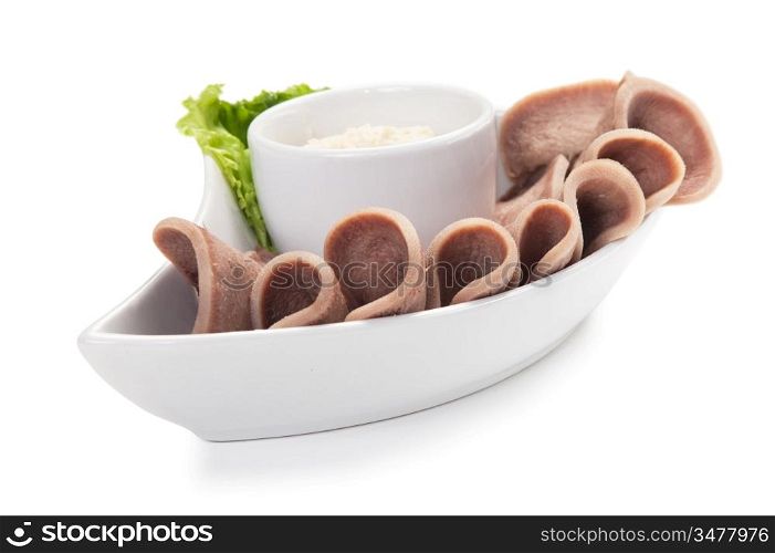 Boiled beef tongue with sauce isolated on white background