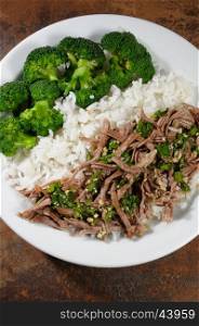 boiled beef with pungent spokes sauce garnish rice with broccoli