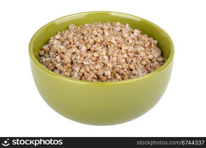 Boiled buckwheat in a green bowl isolated on white background
