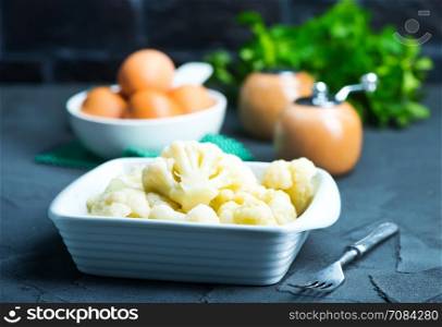 boiled cauliflower in bowl and on a table