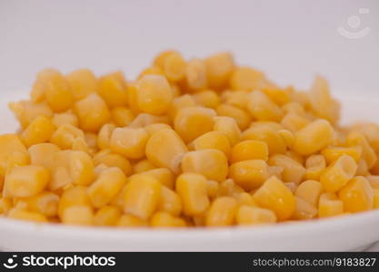 boiled corn close-up on a light background. food ingredients closeup