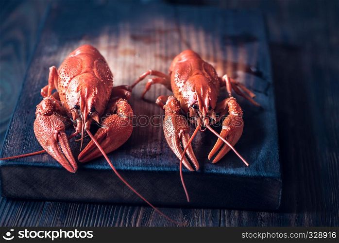 Boiled crayfish on the wooden board