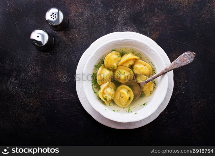 Boiled dumplings in bowl and on a table