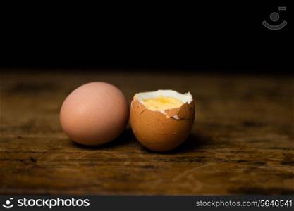 Boiled egg on wooden surface