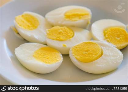 boiled eggs . close up slice of boiled eggs on dish