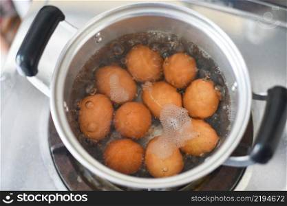 Boiled eggs in a hot pot on the stove, egg cooking healthy eating concept, Eggs menu food