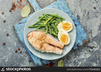 Boiled fish with asparagus and egg.Dietary salmon,boiled salmon. Boiled salmon steak