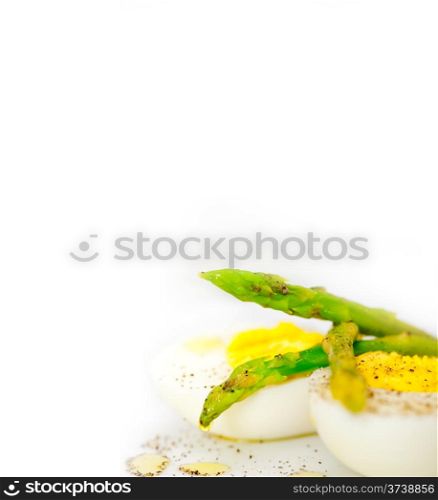 boiled fresh green asparagus and eggs with extra virgin olive oil
