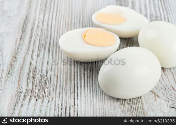 Boiled hen eggs on a wooden background