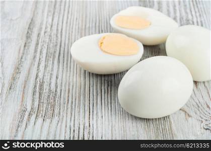 Boiled hen eggs on a wooden background
