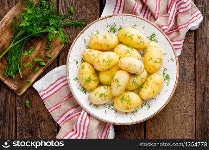 Boiled new potato with butter, dill and green onion