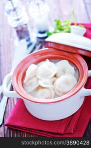 boiled pelmeni with butter in the bowl