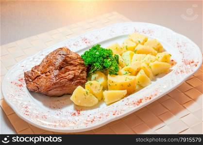 boiled potatoes and roast beef served beautifully