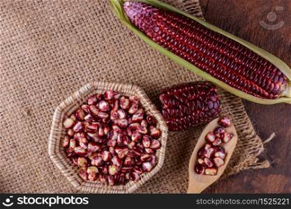Boiled purple corn on wooden background
