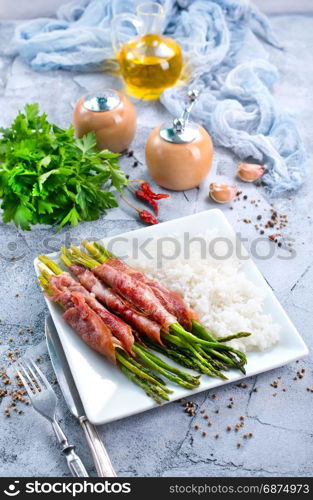 boiled rice with meat and green asparagus