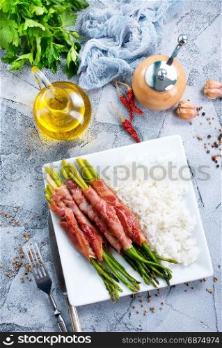 boiled rice with meat and green asparagus