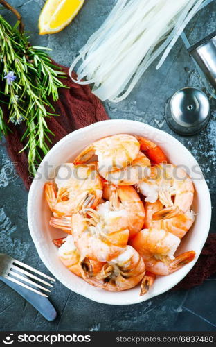 boiled shrimps in bowl and on atable