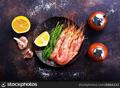 boiled shrimps with salt and spice on a table