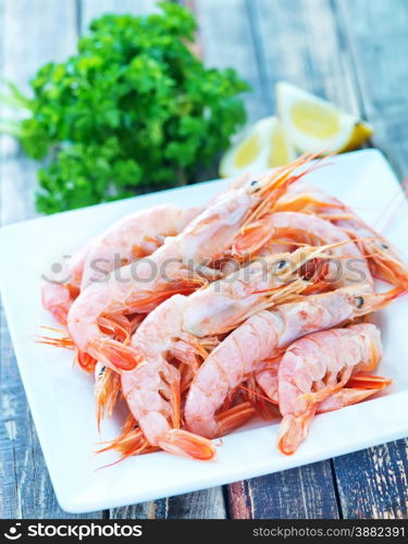 boiled shrimps with salt on the plate