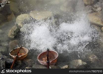 Boiling eggs in hot springs in volcano Tangkuban Perahu in Indonesia