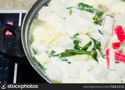 Boiling suki soup in big bowl