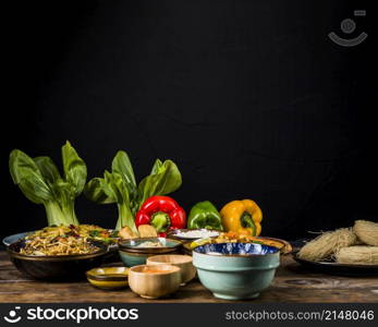 bokchoy bell peppers thai traditional food table against black background