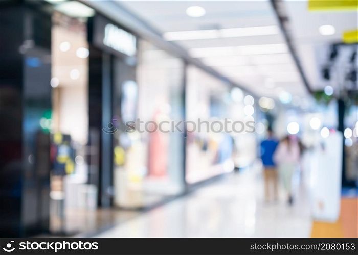 Bokeh abstract blur light of inside shopping complex Department store background