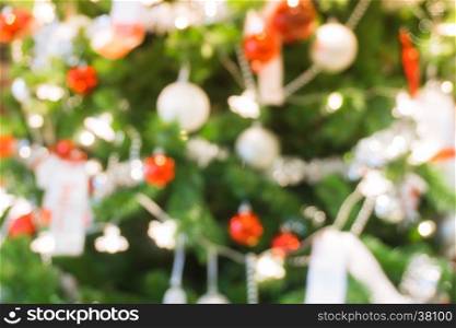 bokeh Christmas balls and Christmas tree with light background