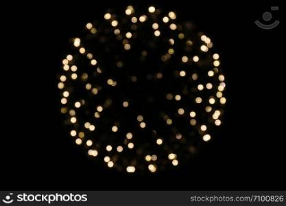 Bokeh circle Light yellow gold sphere on a black background