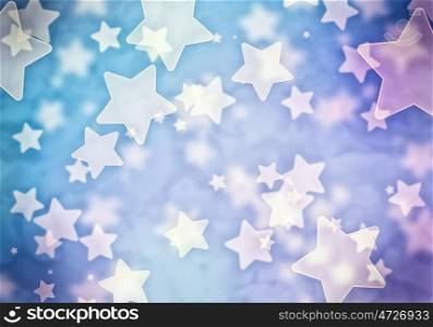 Bokeh lights. Abstract background image of blue stars lights and beams
