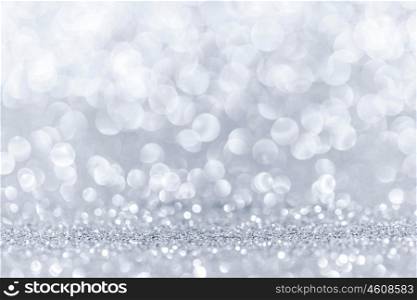 Bokeh lights background. Abstract background with silver shiny glitter bokeh lights