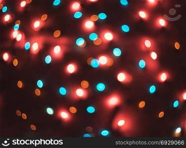 Bokeh. New Year bokeh background. Christmas abstract background with colorful bokeh defocused lights for holiday design. Concept. Blurred garland. Bokeh. New Year bokeh background