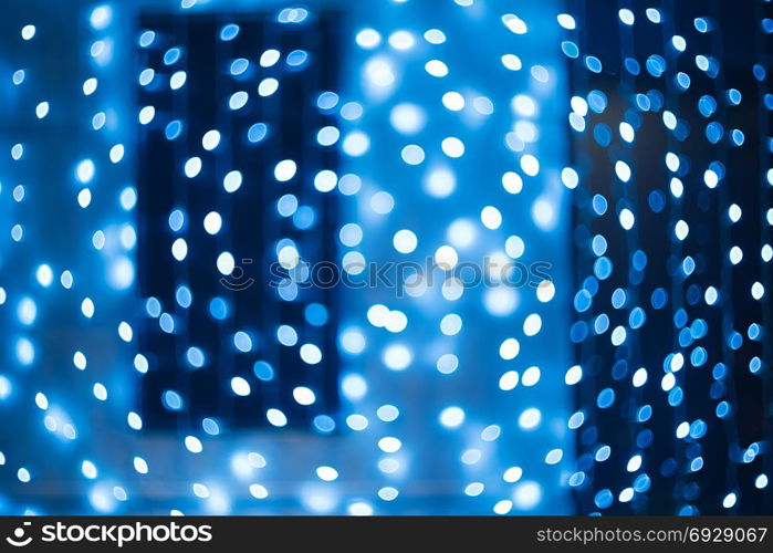 Bokeh. New Year bokeh background. Christmas abstract background with colorful bokeh defocused lights for holiday design. Concept. Blurred garland. Bokeh. New Year bokeh background