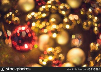 Bokeh. New Year gold bokeh background. Abstract background with colorful bokeh. Defocused. Background for Christmas cards. Beautiful blurred christmas balls. Christmas Lights. Christmas decorations. Bokeh. Christmas abstract background with colorful bokeh