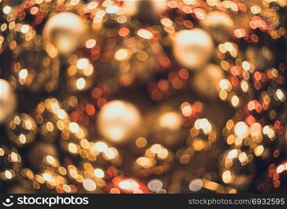 Bokeh. New Year gold bokeh background. Abstract background with colorful bokeh. Defocused. Background for Christmas cards. Beautiful blurred christmas balls. Christmas Lights. Christmas decorations. Bokeh. Christmas abstract background with colorful bokeh
