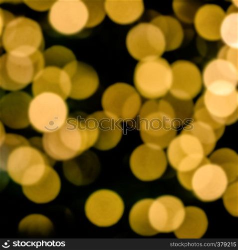 Bokeh of blurred electric candles on a christmas tree, for backgrond
