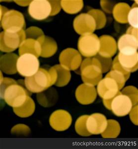 Bokeh of blurred electric candles on a christmas tree, for backgrond