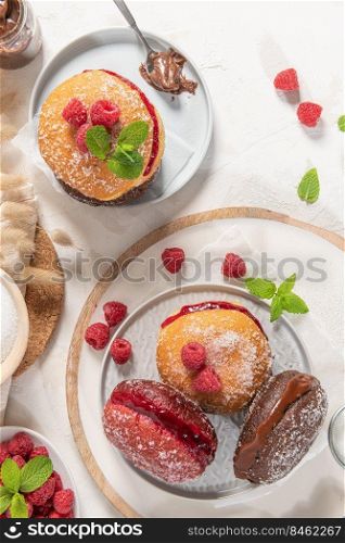 Bolas de Berlim, or  Berlin Balls . Portuguese fried dough with sugar, Filled with chocolate or raspberry jam. Portuguese fried dough with sugar.