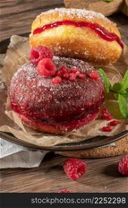 "Bolas de Berlim, or "Berlin Balls". Portuguese fried dough with sugar, Filled with chocolate or raspberry jam. Portuguese fried dough with sugar."